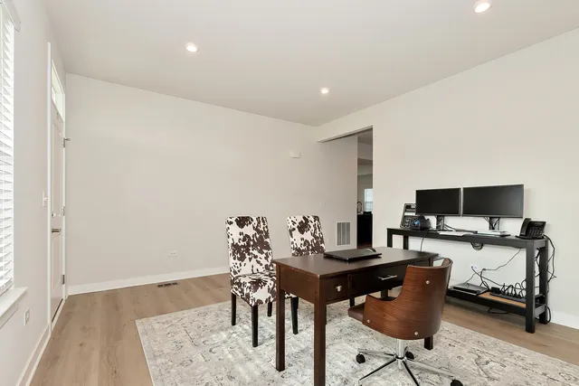 a workspace with furniture and a flat screen tv