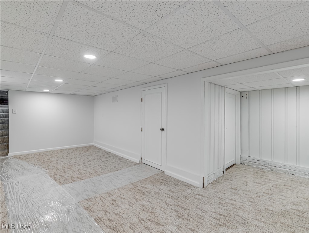3553 Mogadore Road Mogadore, OH 44260 - Photo 23 of 29 Basement with light colored carpet and a drop ceiling
