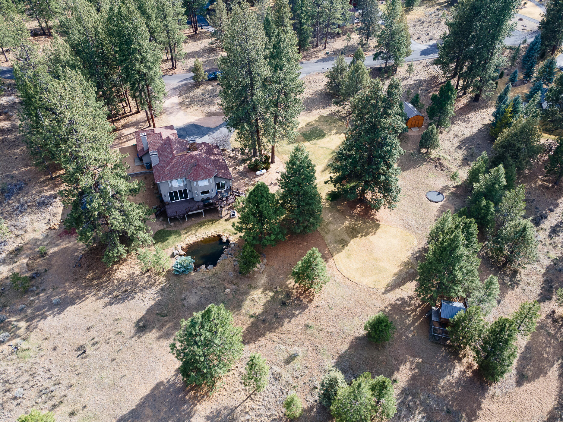 60012 West Ridgeview Drive Bend, OR 97702 - Photo 52 of 55 an aerial view of a house with a yard