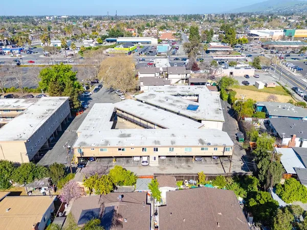 an aerial view of residential houses with outdoor space