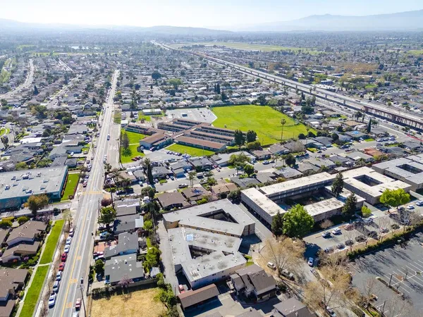 an aerial view of residential houses with outdoor space