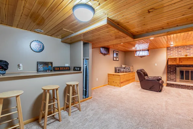 a kitchen with a stove a refrigerator and a table