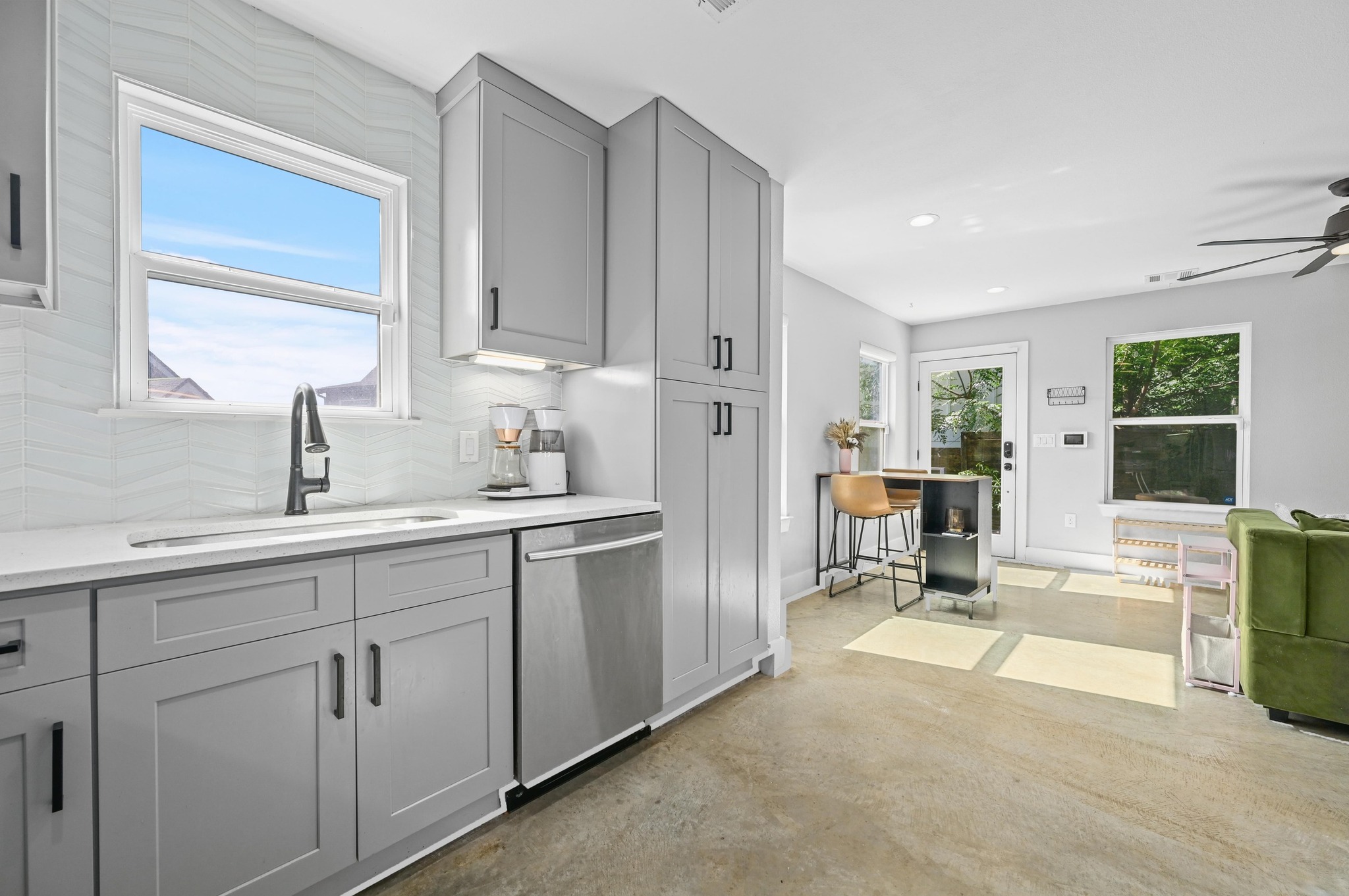 1210 Luna Street, Unit 2 Austin, TX 78721 - Photo 5 of 17 a kitchen with cabinets and outdoor view