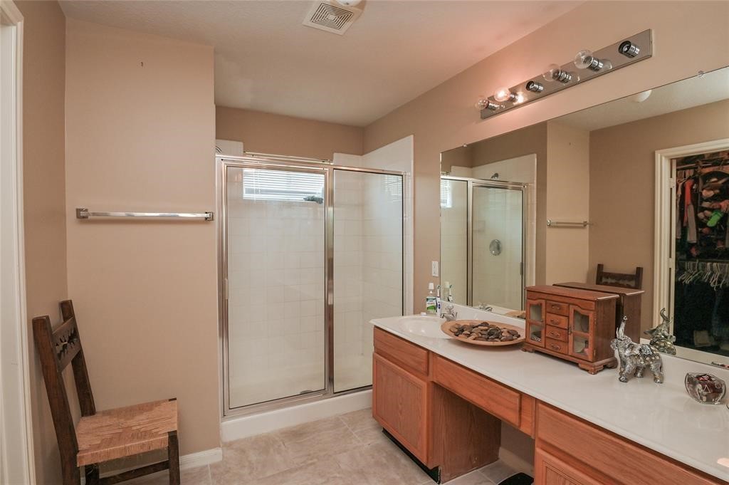 18446 South Wimbledon Drive Katy, TX 77449 - Photo 21 of 24 a bathroom with a sink double vanity and a mirror