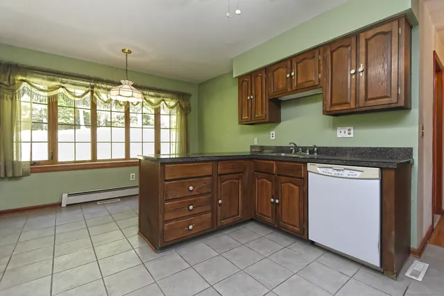 a kitchen with a cabinets and window