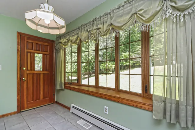 a view of a room with a large window