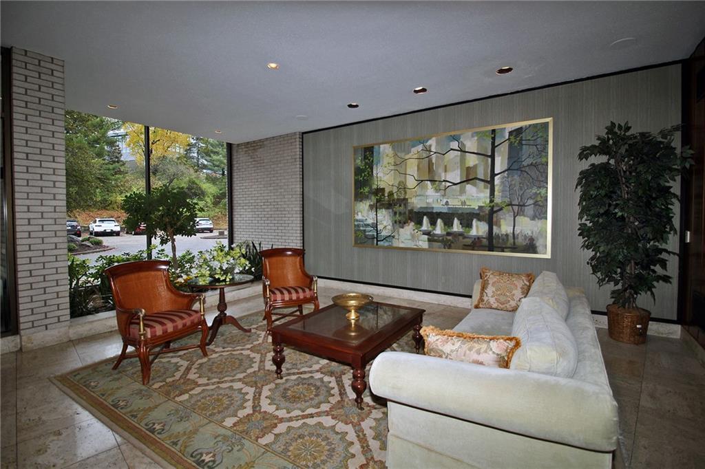 1160 Bower Hill Road, Unit 310A Pittsburgh, PA 15243 - Photo 39 of 46 a living room with furniture and a large window