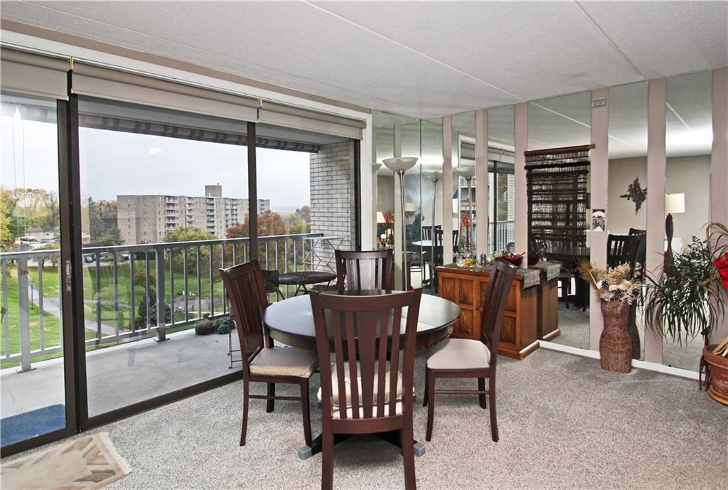1160 Bower Hill Road, Unit 310A Pittsburgh, PA 15243 - Photo 4 of 46 a dining room with furniture mountain view and a floor to ceiling window