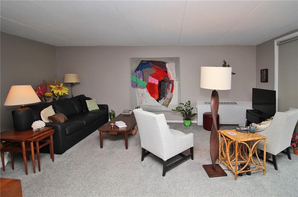 1160 Bower Hill Road, Unit 310A Pittsburgh, PA 15243 - Photo 7 of 46 a living room with furniture and a lamp