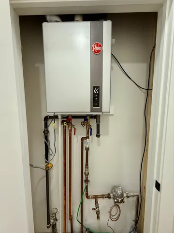 a bathroom with a toilet sink and shower