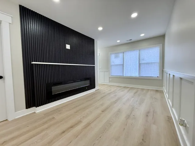 a view of a kitchen with a sink and cabinets
