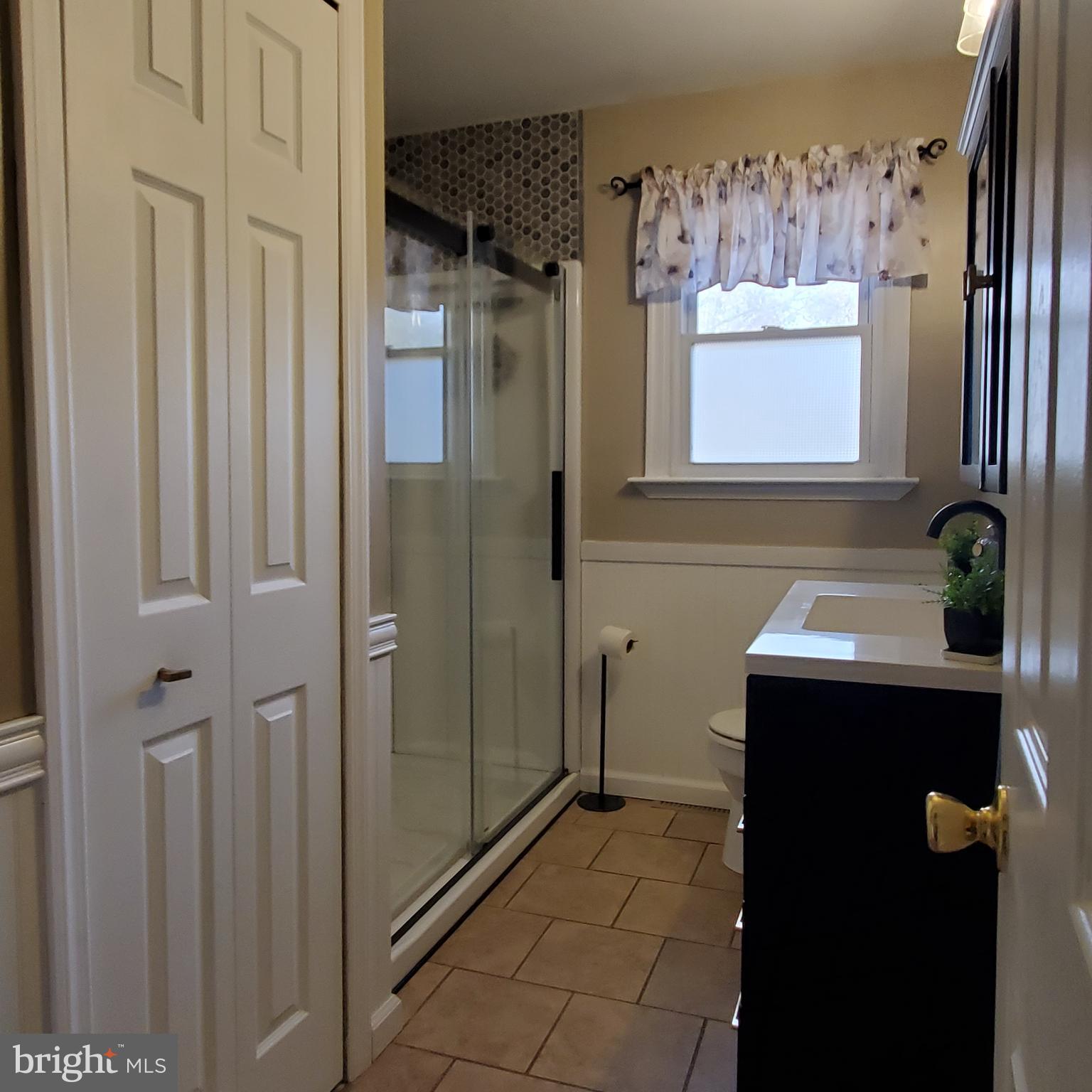 158 Telegraph Road Bridgeton, NJ 08302 - Photo 13 of 18 a bathroom with a sink and mirror with shower