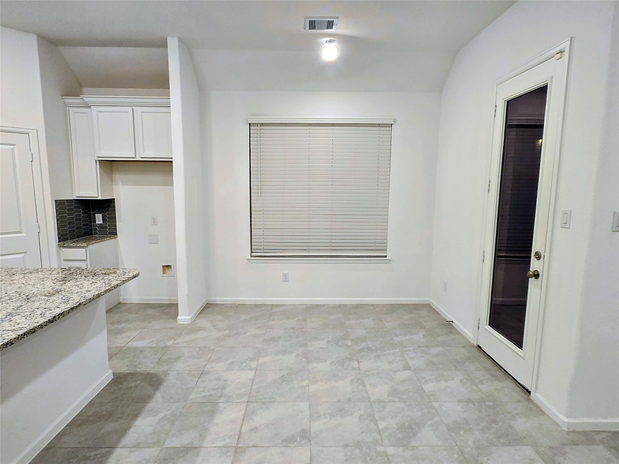 3632 Richmont Court Rosenberg, TX 77469 - Photo 10 of 23 a view of an empty room with a fireplace and a cabinets