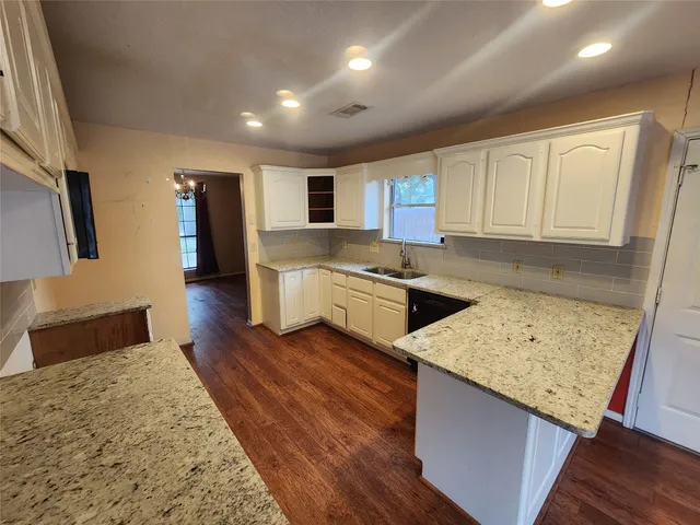 a kitchen with a sink stove and refrigerator