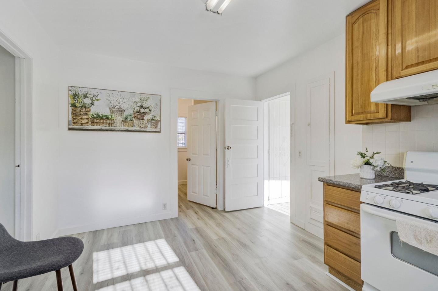 3618 MacArthur Boulevard Oakland, CA 94619 - Photo 17 of 65 a view of kitchen with furniture and wooden floor