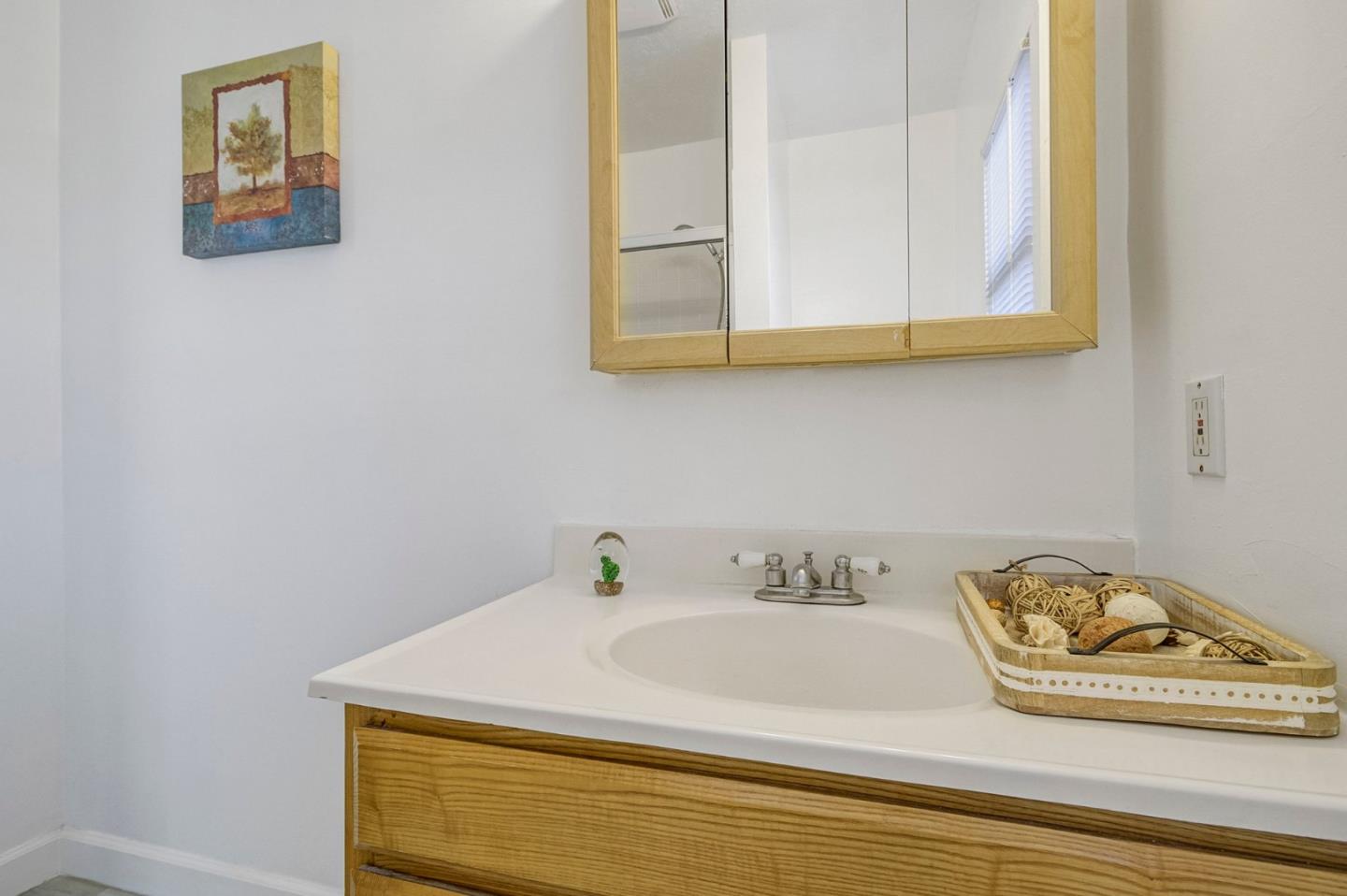 3618 MacArthur Boulevard Oakland, CA 94619 - Photo 19 of 65 a bathroom with a sink and a mirror