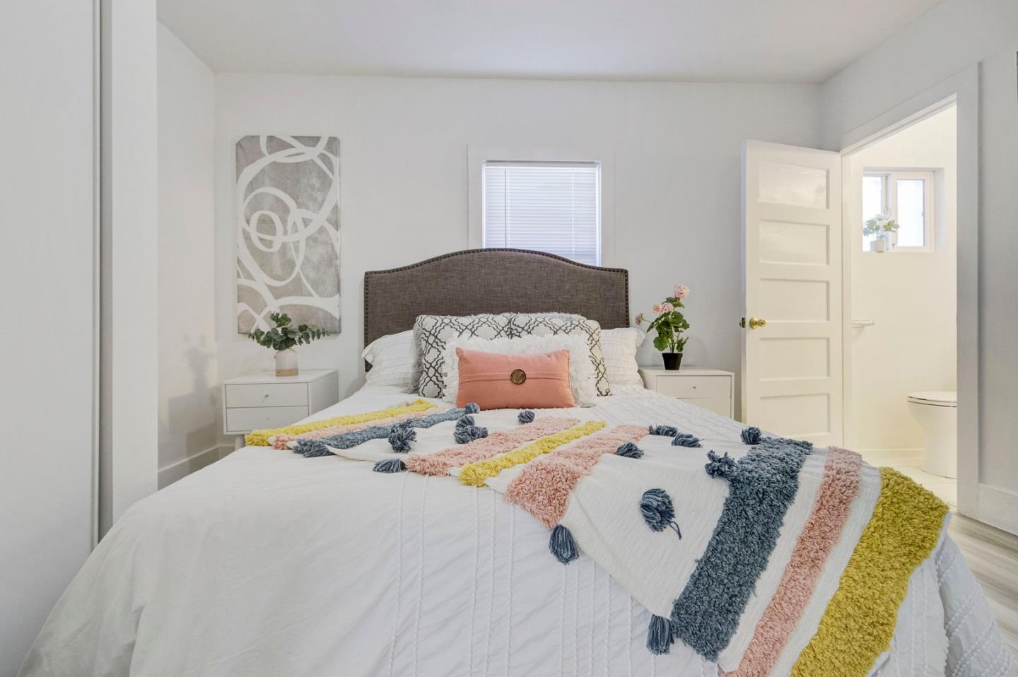 3618 MacArthur Boulevard Oakland, CA 94619 - Photo 21 of 65 a bedroom with a bed and a painting on the wall