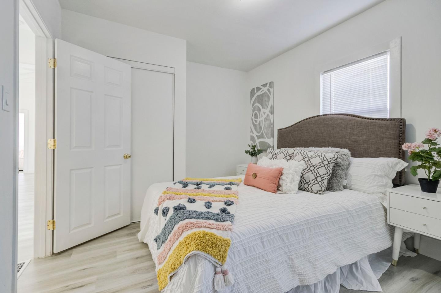 3618 MacArthur Boulevard Oakland, CA 94619 - Photo 22 of 65 a bedroom with a bed and wooden floor