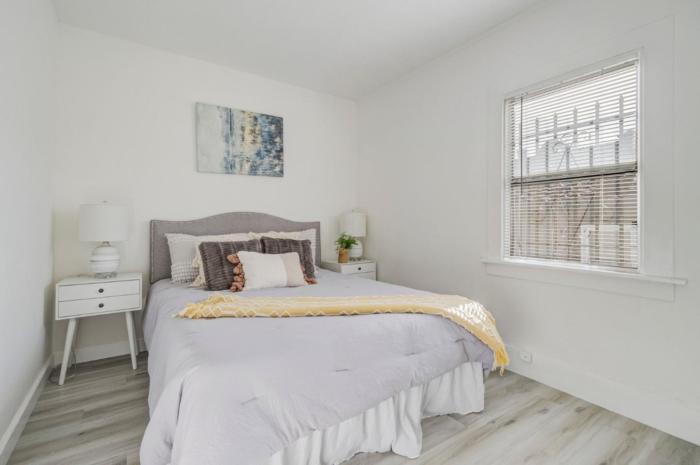 3618 MacArthur Boulevard Oakland, CA 94619 - Photo 25 of 65 a bedroom with a bed and wooden floor