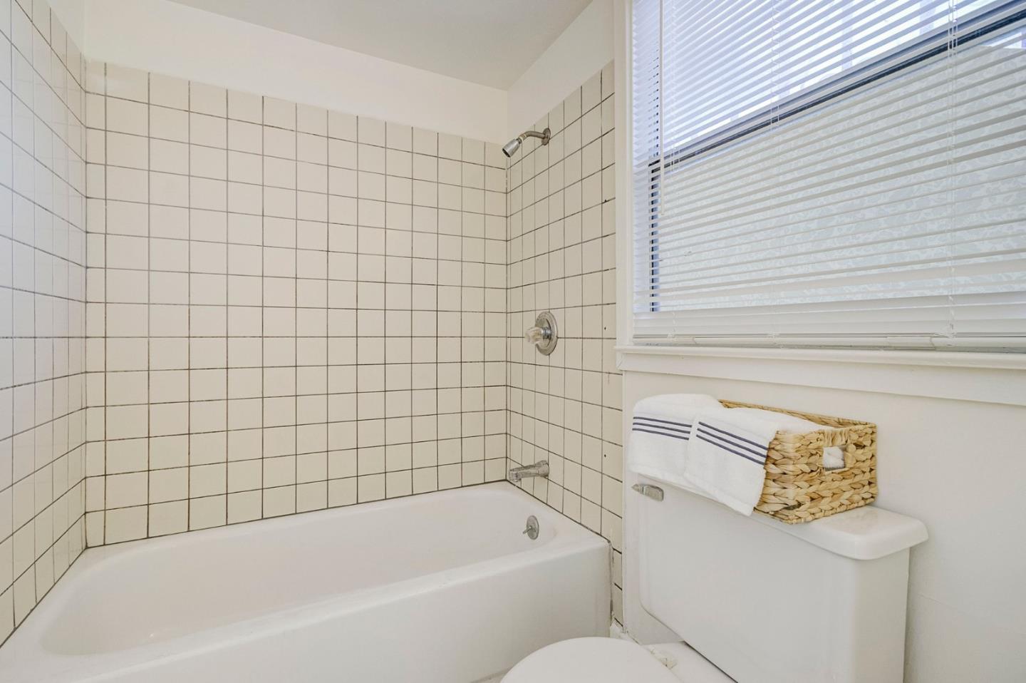 3618 MacArthur Boulevard Oakland, CA 94619 - Photo 30 of 65 a bathroom with a bathtub and shower