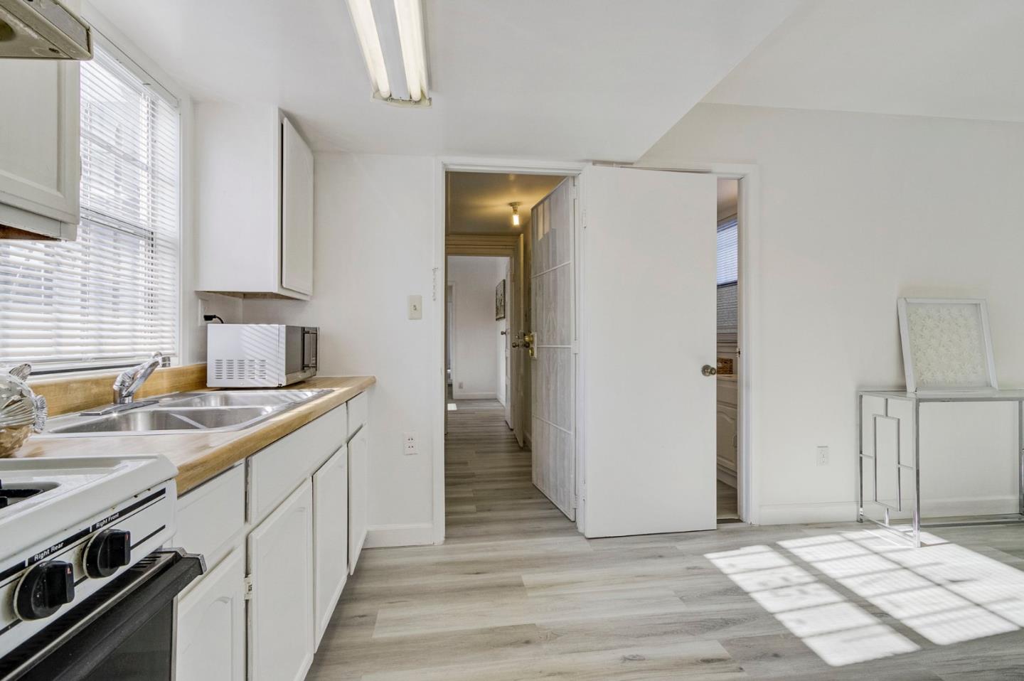 3618 MacArthur Boulevard Oakland, CA 94619 - Photo 35 of 65 a kitchen with a sink stove and refrigerator