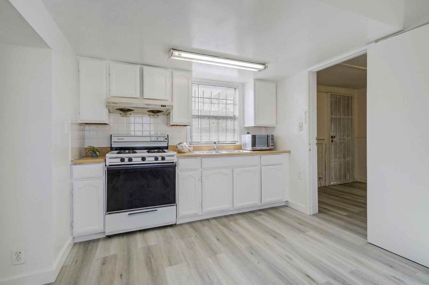 3618 MacArthur Boulevard Oakland, CA 94619 - Photo 36 of 65 a kitchen with a sink and a stove top oven