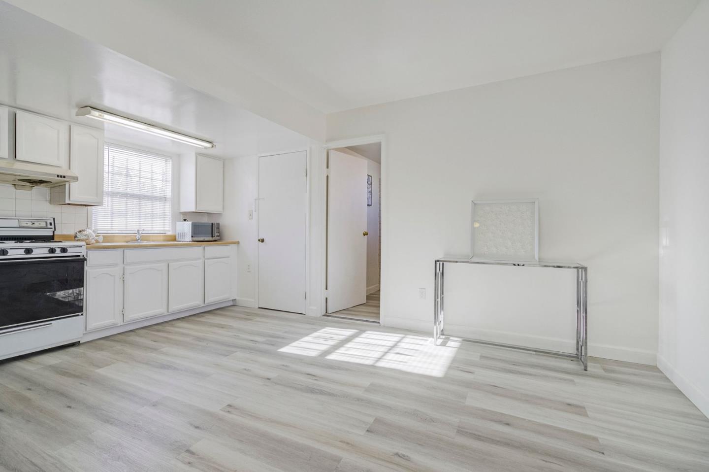 3618 MacArthur Boulevard Oakland, CA 94619 - Photo 38 of 65 a kitchen with granite countertop white cabinets and white appliances