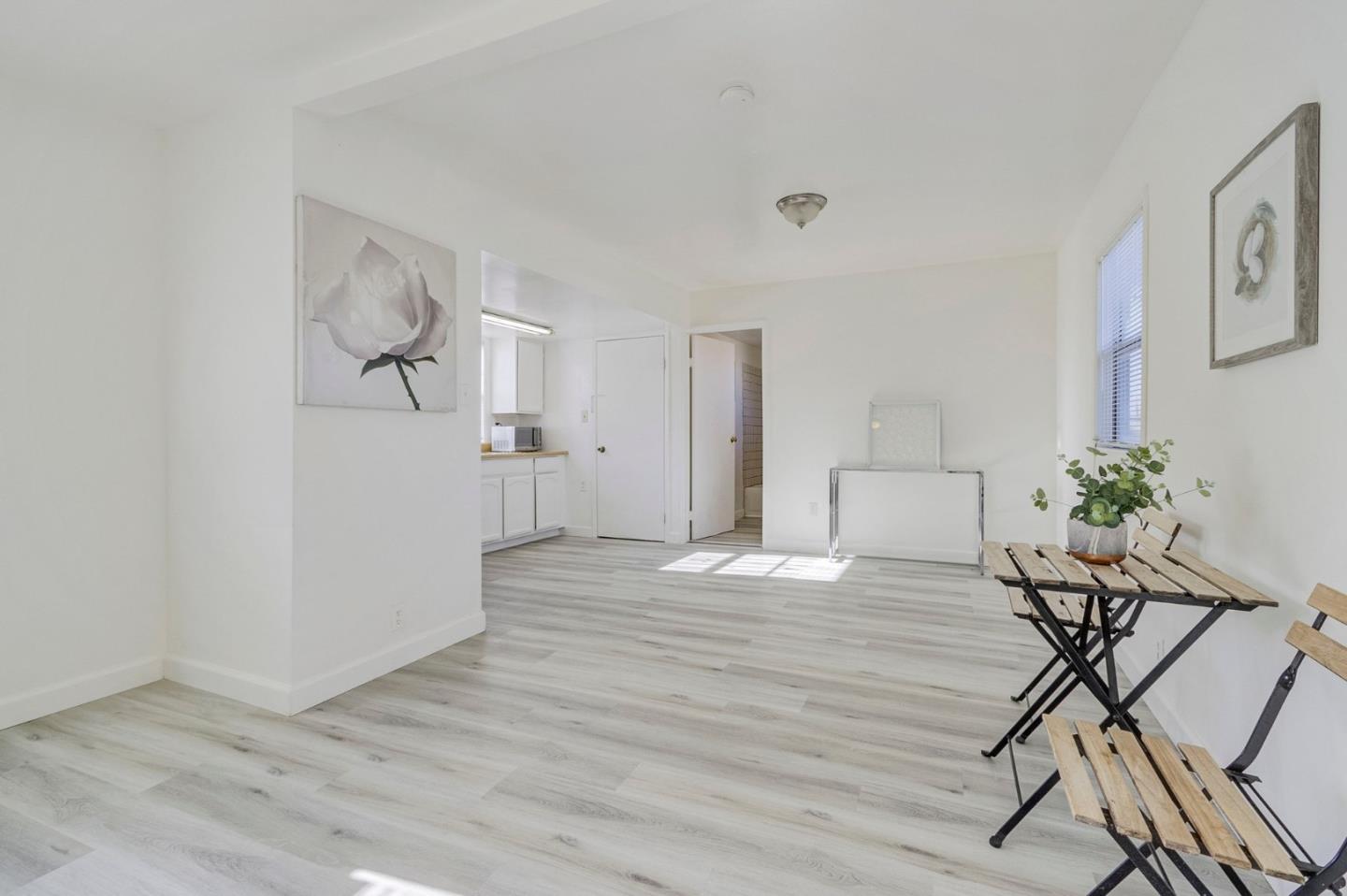 3618 MacArthur Boulevard Oakland, CA 94619 - Photo 43 of 65 a view of a workspace room with wooden floor and windows