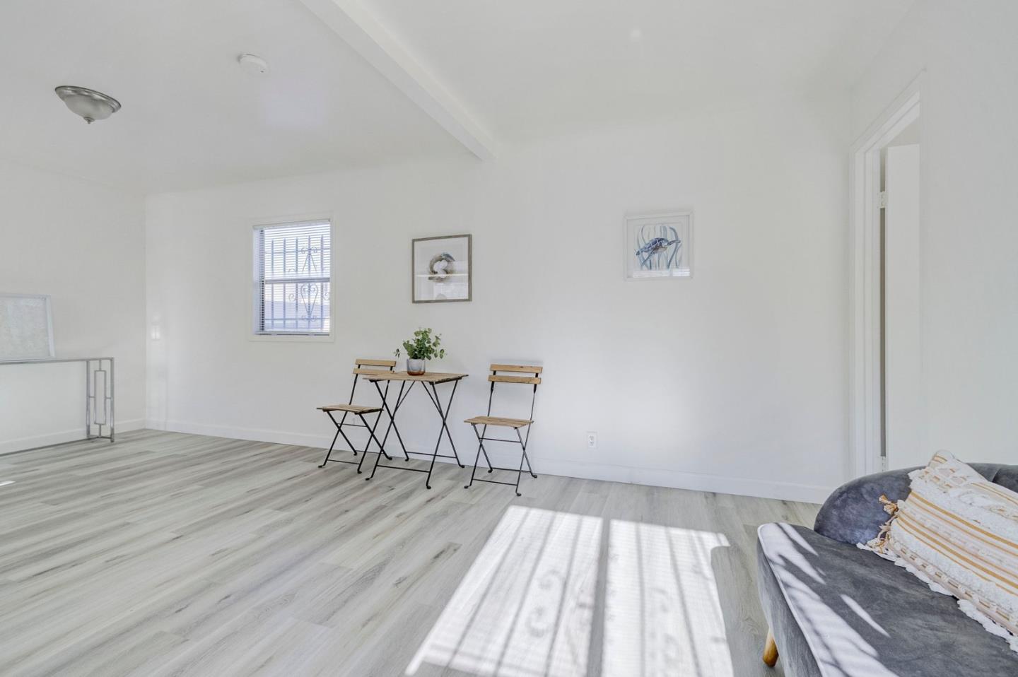 3618 MacArthur Boulevard Oakland, CA 94619 - Photo 44 of 65 a view of a room with wooden floor and windows