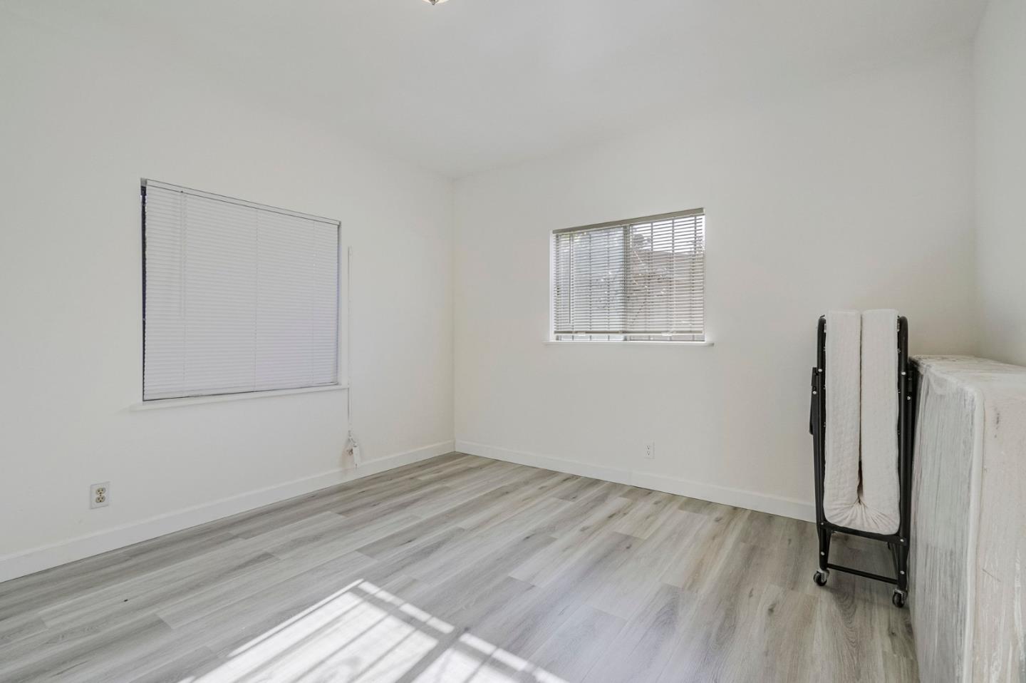 3618 MacArthur Boulevard Oakland, CA 94619 - Photo 45 of 65 a view of empty room with wooden floor and fan