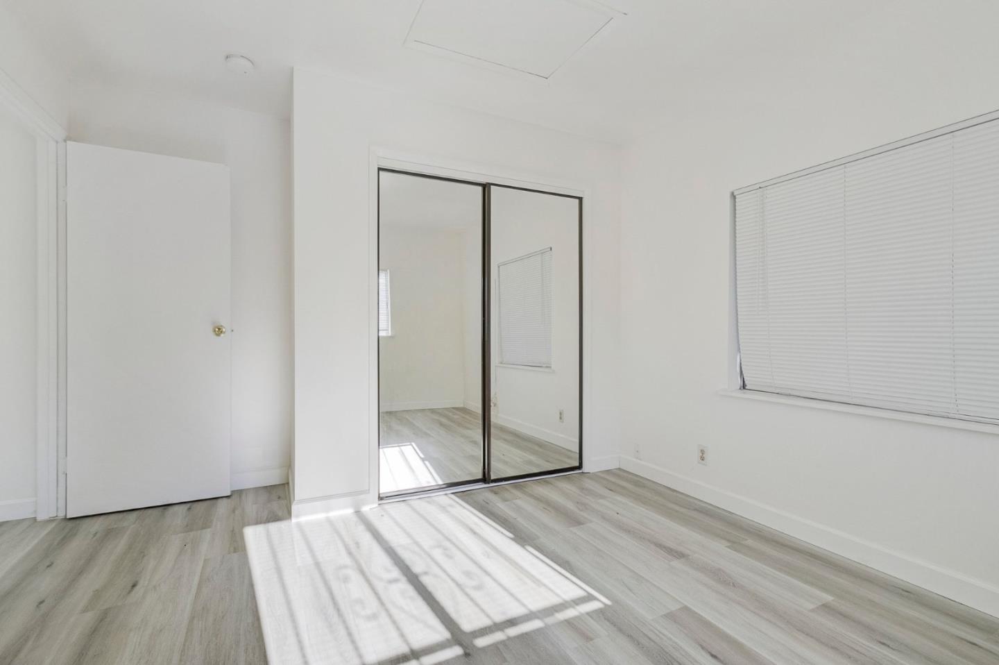 3618 MacArthur Boulevard Oakland, CA 94619 - Photo 47 of 65 a view of a room with wooden floor and white doors