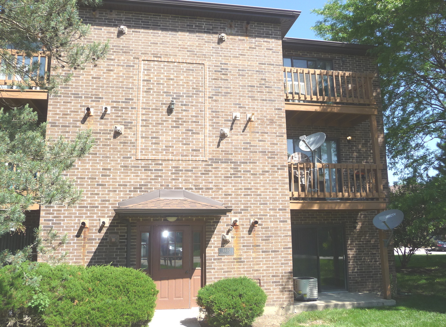 a front view of a house with yard