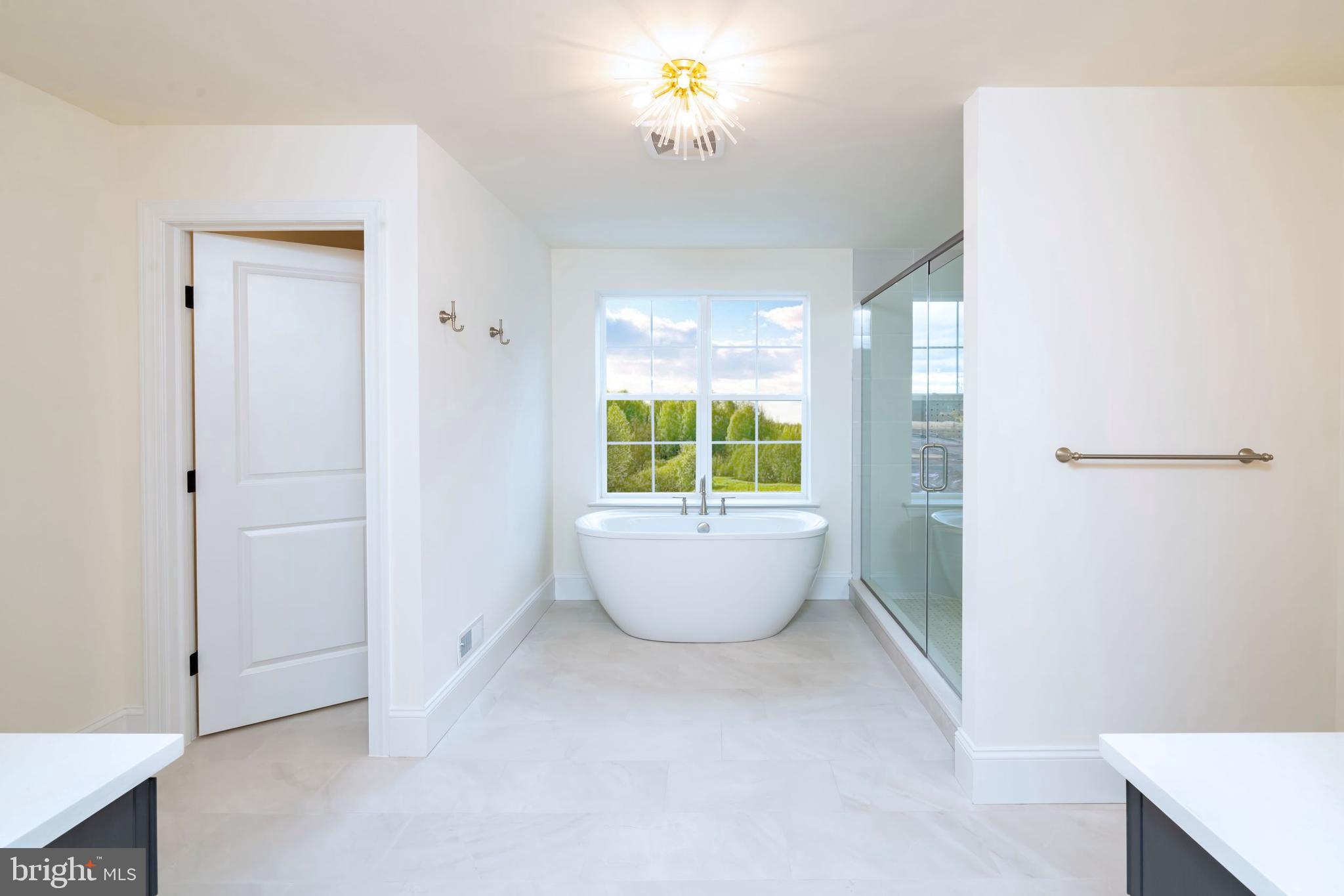 190 Plymouth Road Blue Bell, PA 19422 - Photo 10 of 27 a living room with a window and a potted plant