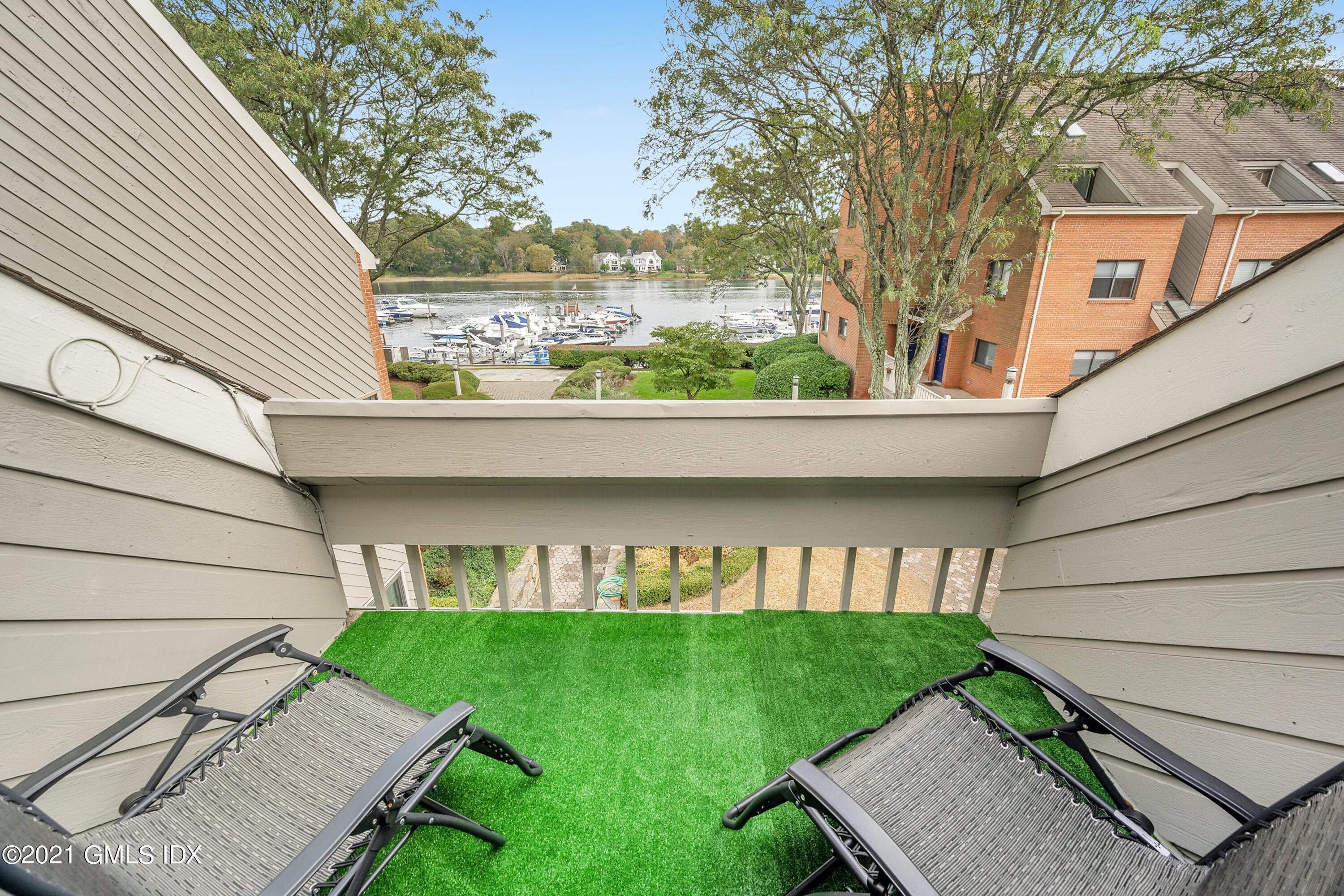 7 River Road, Unit 303 Cos Cob, CT 06807 - Photo 16 of 20 a view of house with a yard