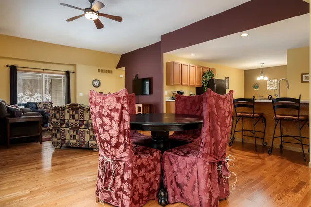 a view of a dining room with furniture and wooden floor