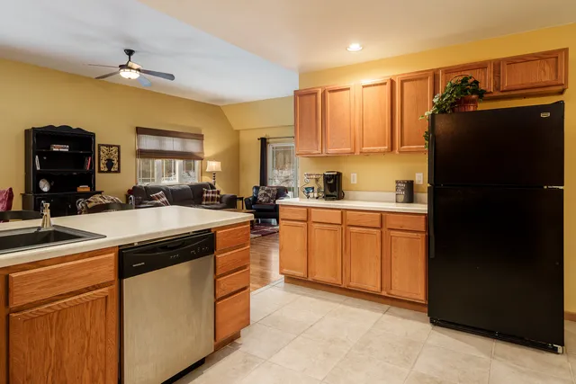 a kitchen with cabinets a sink and appliances