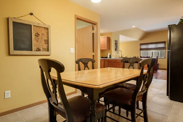 a view of a dining room with furniture and window