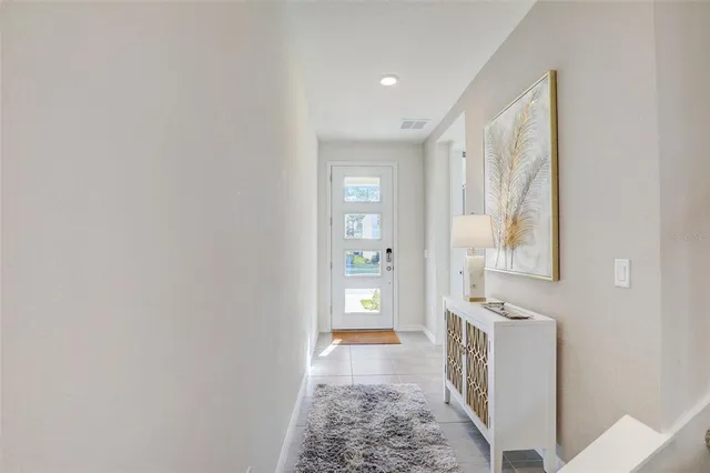 a living room with stainless steel appliances kitchen island granite countertop furniture and a view of kitchen