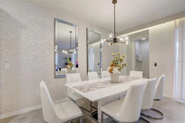 a bathroom with a sink a toilet a mirror a bathtub and shower