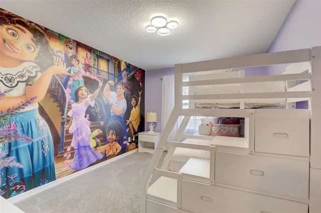 a room with lots of furniture and glass door