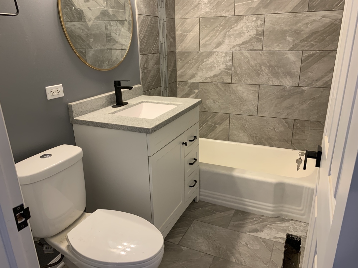74 West 140th Street Riverdale, IL 60827 - Photo 11 of 20 a bathroom with a sink a toilet and a mirror