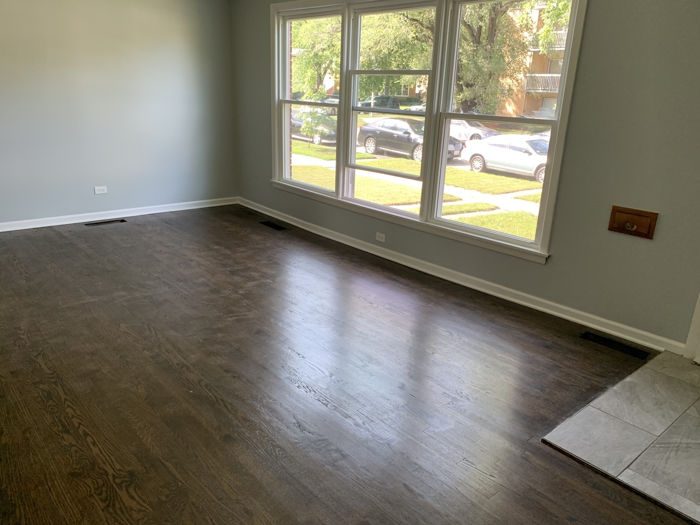 74 West 140th Street Riverdale, IL 60827 - Photo 14 of 20 an empty room with wooden floor and windows