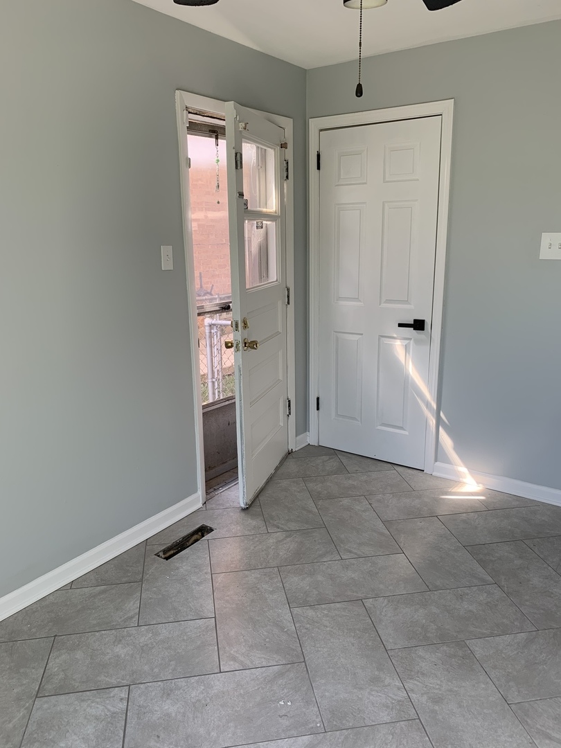 74 West 140th Street Riverdale, IL 60827 - Photo 17 of 20 a view of an empty room with window and entryway