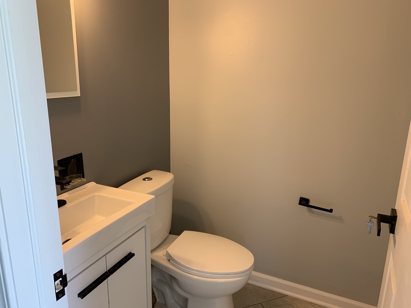 74 West 140th Street Riverdale, IL 60827 - Photo 19 of 20 a bathroom with a toilet and a sink