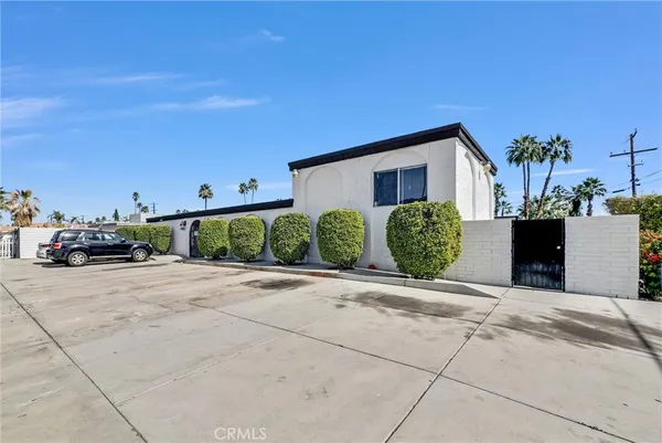 a view of a house with a street