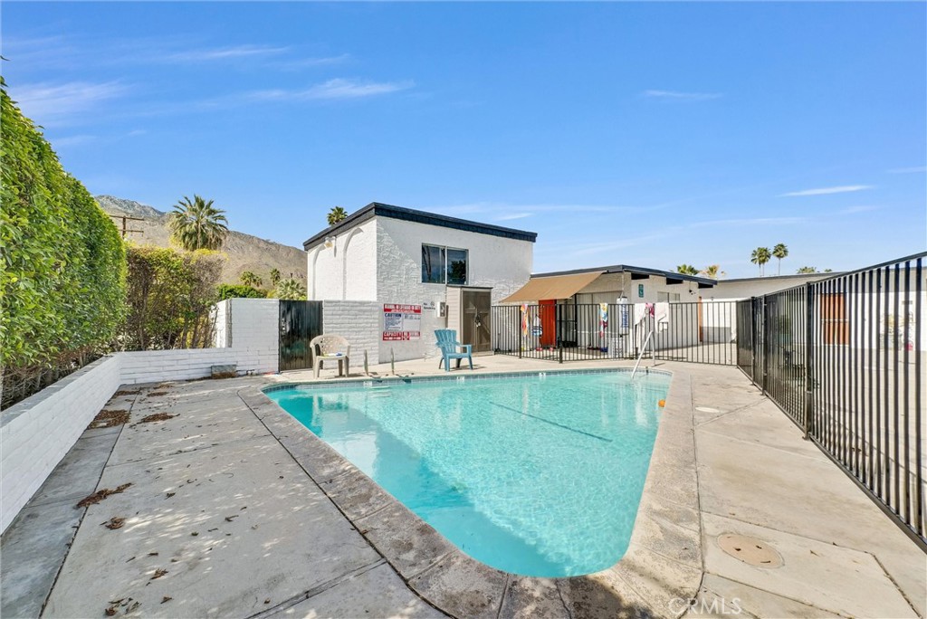 1900 East Baristo Road Palm Springs, CA 92262 - Photo 8 of 23 a view of a house with a swimming pool