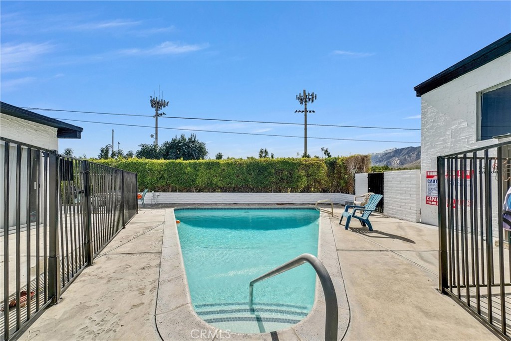 1900 East Baristo Road Palm Springs, CA 92262 - Photo 10 of 23 a view of a swimming pool with a patio