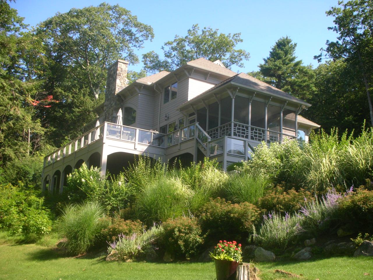 40 Elephant Rock Road Monterey, MA 01245 - Photo 1 of 14 a aerial view of a house with a yard and potted plants