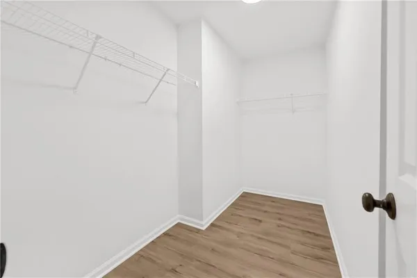 a balcony with wooden floor and trees
