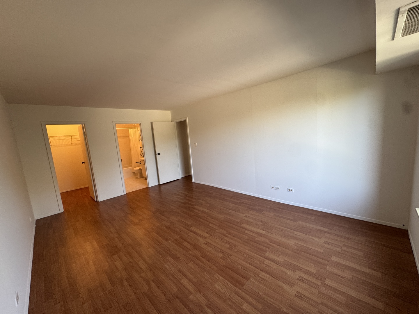 1415 East Central Road, Unit 301A Arlington Heights, IL 60005 - Photo 6 of 11 a view of empty room with wooden floor and fan